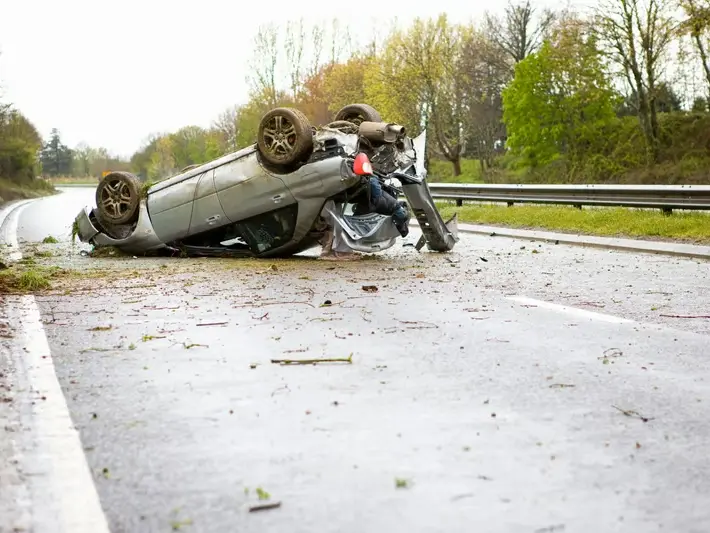 Illegal left turn accident attorney reviewing crash evidence from a wide Mesa intersection near Superstition Springs